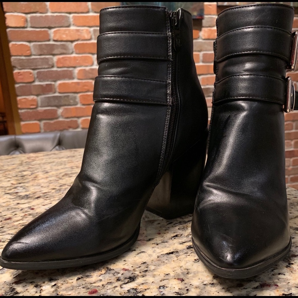 Black heeled booties with buckles